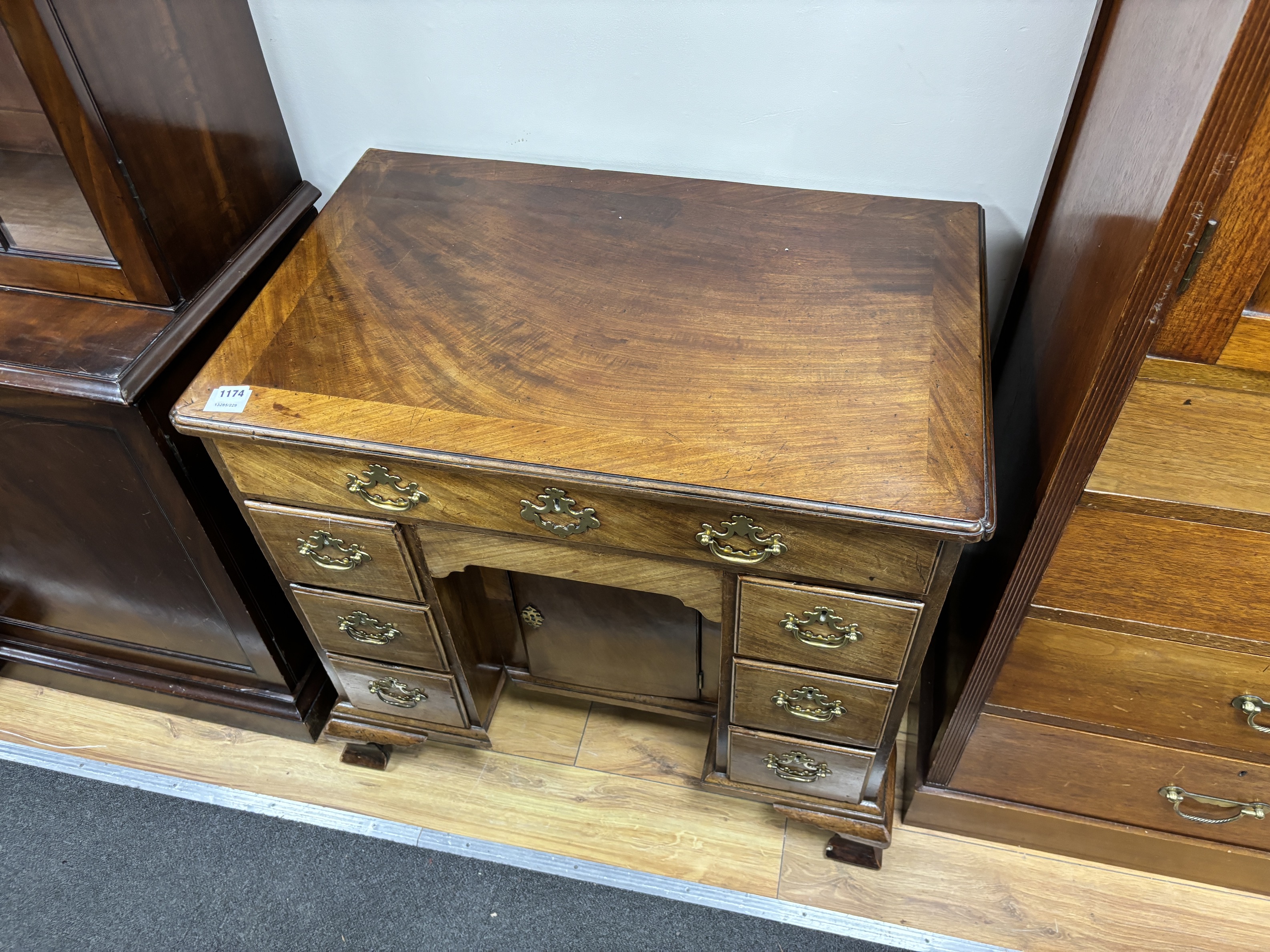 An 18th century mahogany kneehole desk, width 83cm, depth 52cm, height 76cm
